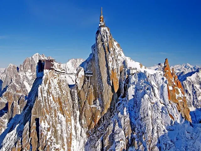 Aiguille du Midi peak with viewing platforms on a sunny day